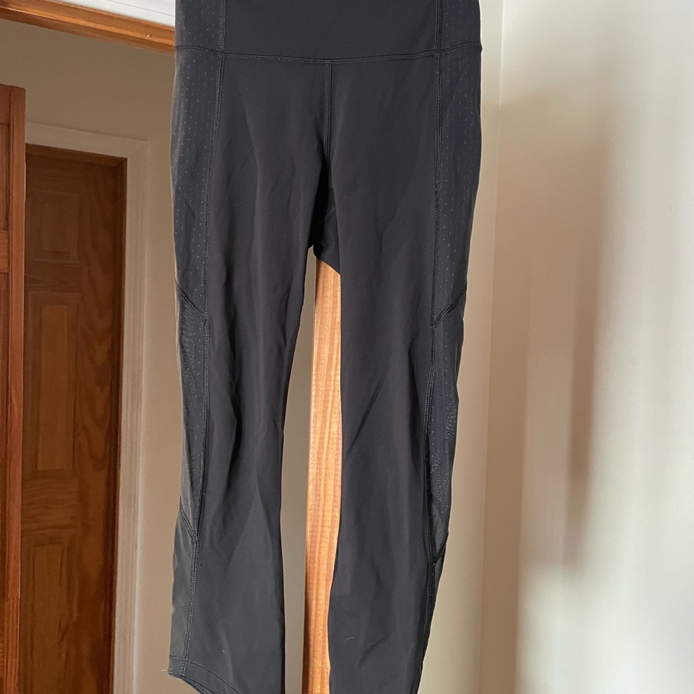 Lululemon Black High-Waisted Leggings, size 4, mesh detail on bottom
